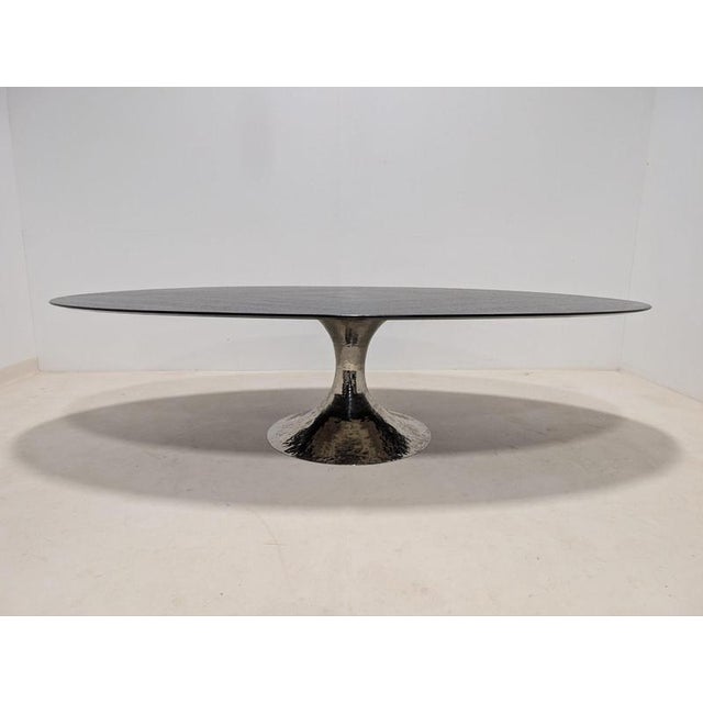 A beautiful julian chichester dakota table, featuring a commanding oval silhouette. The expansive tabletop is finished in...