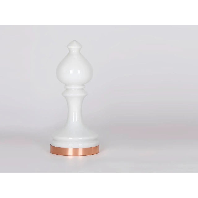 Produced in Valašské Meziriči in the 1970s. The lamp is made of white frosted glass with a copper band as a base. It is...