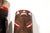 A captivating pair of African tribal masks. Hand carved wood and hand painted with feathers. In good vintage condition....