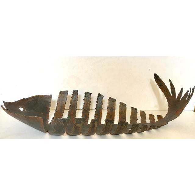 Great as an art piece or functional as a bowl to hold fruit. This hand made forged iron bowl in the shape of a fish skeleton.