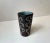 Ceramic vase decorated in glaze with abstract motif and interior green glaze. Designed by the danish ceramist Helge...
