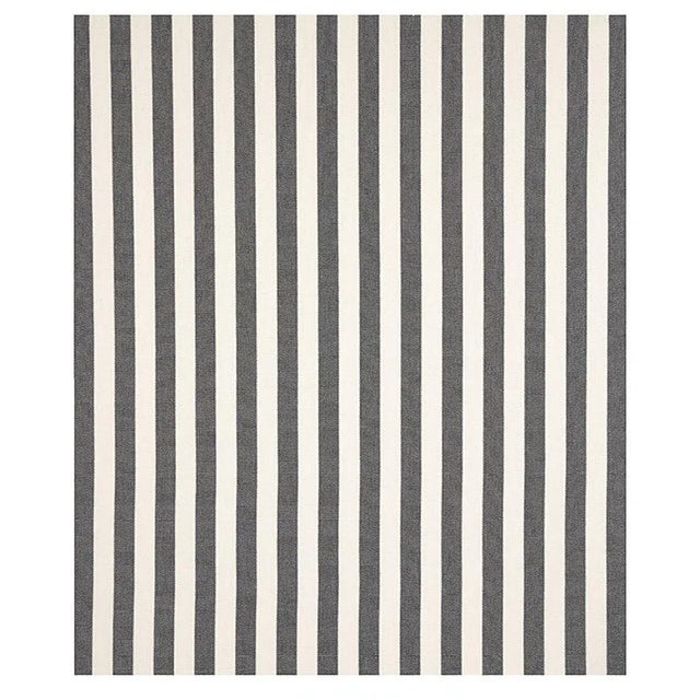 With its classic yet graphically outlined stripes, Blumont Stripe Indoor/Outdoor fabric combines high performance...