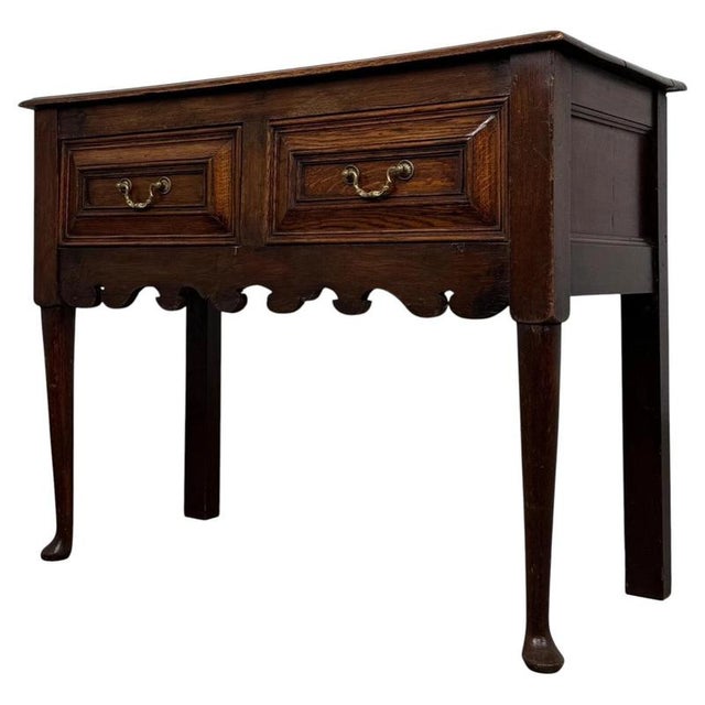 A handsome 19th-century English dresser base, crafted from oak in the Jacobean style and distinguished by its substantial...
