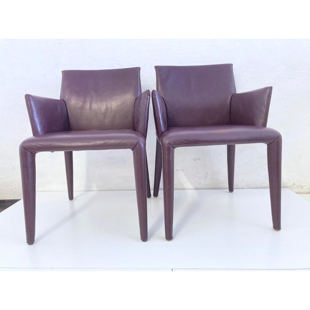 Two armchairs by B&B, Italia, model Vol au Vent. Designed by Mario Bellini, 2001. Bordeaux leather. Good used condition....