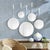 This unique set of five round mirrors are a great way to add interest and a reflective element to a room. The matte...