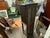 19th century gothic cabinet with open bottom shelf. Geometric carved design on leg base, figure and floral design on door....