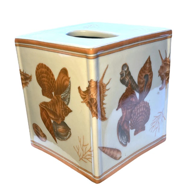 Set of three porcelain vanity set including Tissue box, Toothbrush Holder and Trinket Box made by Amita. Features seashell...