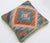 A one-of-a-kind handwoven Afghan wool kilim accent pillow featuring vivid concentric diamond. Cut and sewn by hand from a...