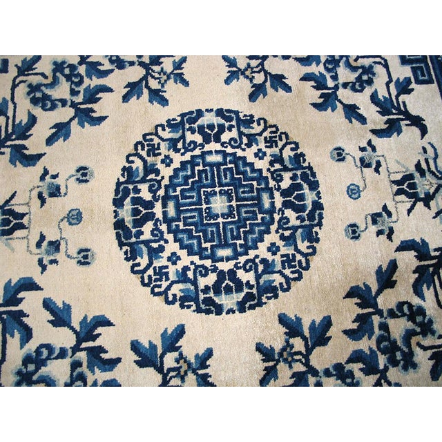 Sensational Floral-Medallion on a Ivory Background and Blue Border Antique Chinese Ningxia Rug For Sale - Image 4 of 7
