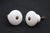 Vintage cabinet or drawer knobs made of white ceramic with a round shape. Mounting screws are included. Good condition...