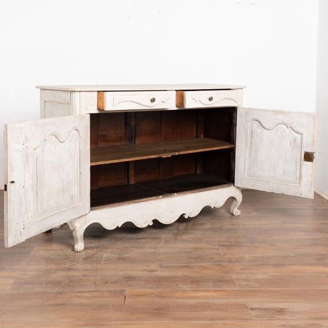 This lovely sideboard has been given a white painted finish, adding a fresh touch to its charming French country style....