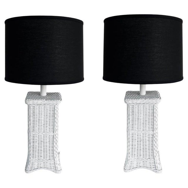Palm Beach Coastal Chic White Wicker Table Lamps with Harps and Finials, a Pair Offered for sale is a pair of white...