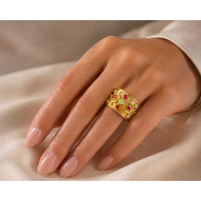 18k Hand fabricated yellow gold Etruscan style gold ring featuring 4 square cut fine rubies weighing 1.00 carat and five...