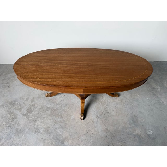 Hollywood Regency 1960s Hollywood Regency Neoclassical Style Mahogany Oval Coffee Table With Brass Claw Feet For Sale - Image 3 of 12