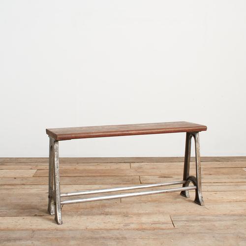 A school locker room bench, with a lovely original hardwood wooden top salvaged from a Grammar school. The bench has cast...