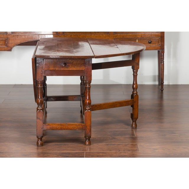 English English Oval Oak Drop-Leaf Table with Single Drawer and Baluster Legs For Sale - Image 3 of 11