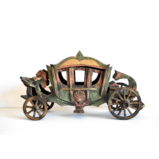 An antique carriage in the 18th-century style, made in the late 19th or very early 20th-centuries, and used by the Paul F....
