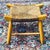 Charming vintage French Country footstool handcrafted from solid ash wood features a curved saddle seat of woven rush....