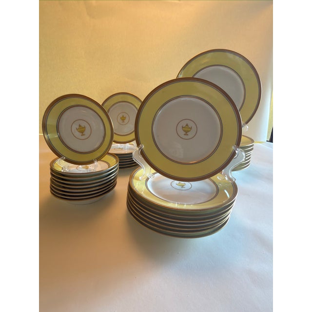 An elegant 46- piece porcelain dinner service in Richard Ginori’s celebrated “Impero Yellow” pattern — the storied Italian...