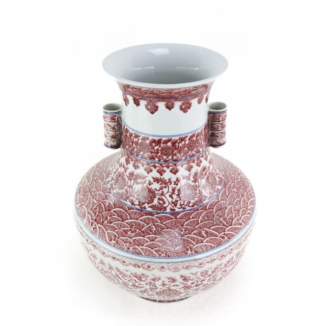 Qianlong Mark, Blue and White Underglaze Red Flower and Seawater Pattern Large Vase This vase features an open mouth and a...