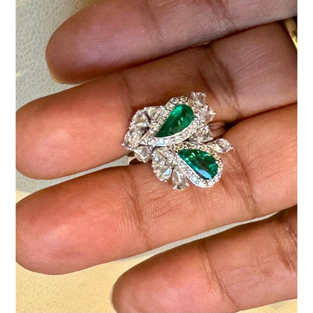 1.2Ct Finest Zambian Fancy pear Emerald & 1.3Ct Diamond Ring, 18 Kt Gold , size 7 This classic ring features a two fancy...