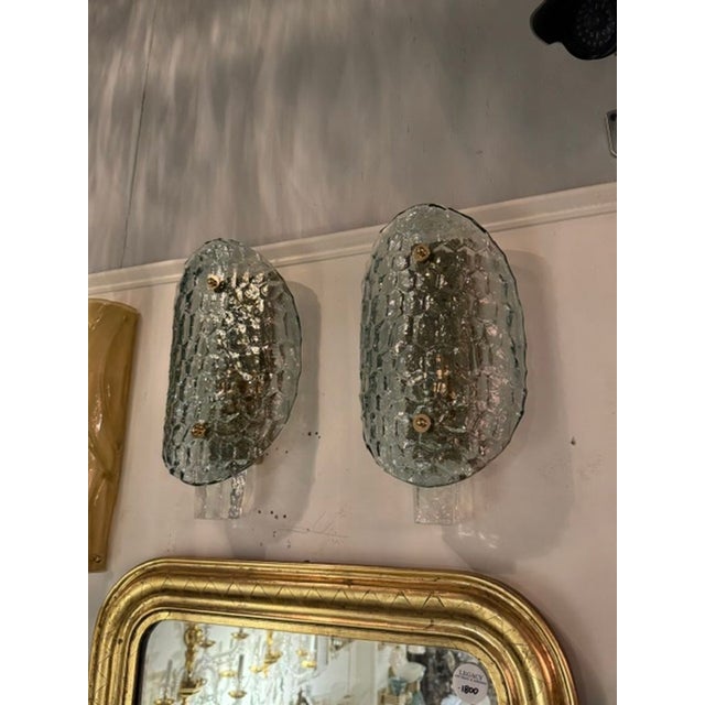 The product is a pair of Murano turtle shell sconces in Fontana Green. These sconces are unique and elegant that would add...