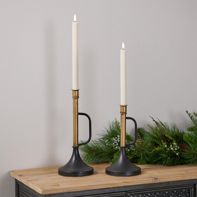 Enhance your home with the timeless elegance of our Metal Trumpet Taper Candle Holder Set. This sophisticated pair,...