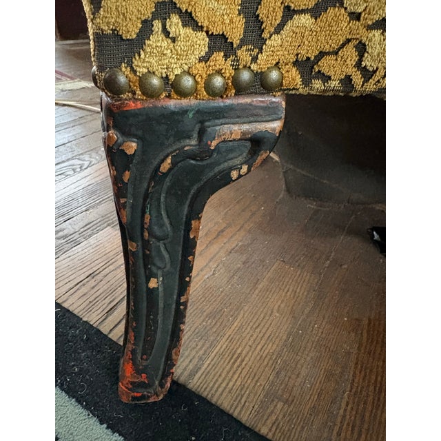 Offered is a striking 1940s/1950s throne-height wingback chair with a matching claw-foot ottoman. Passed down from the...