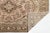 Elevate your interior space with this exquisite vintage hand-knotted wool rug, featuring a sophisticated muted palette of...