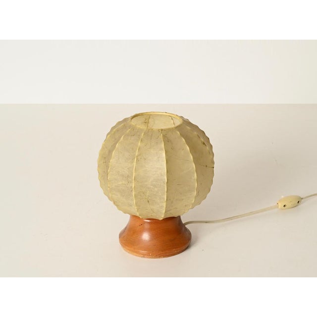 Wonderful and unique cocoon table lamp with a marvelous marbled finish and a ribbed silhouette. This stylish lamp was...