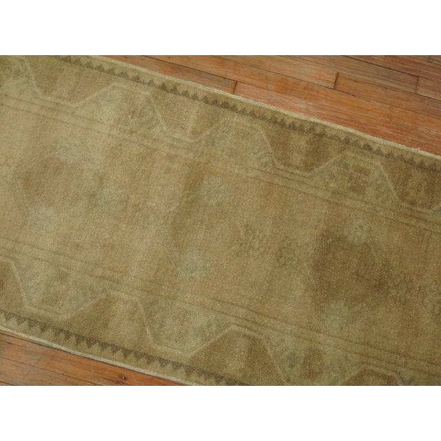 Narrow and long tone on tone Turkish Oushak runner. Small hints of green that can barely be seen, circa mid-20th century,...