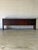 This long credenza features a streamlined profile with a functional blend of sliding doors and deep drawers. Integrated...