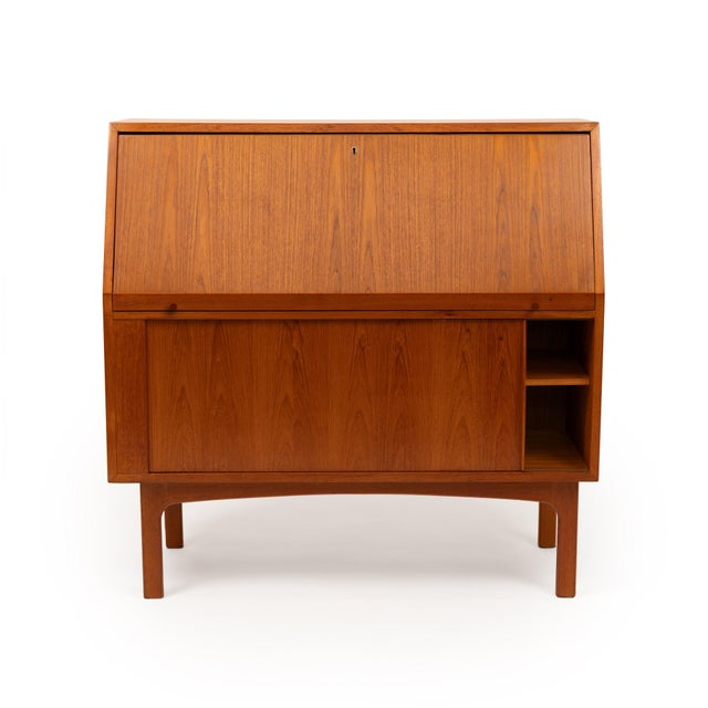 Designed by Danish manufacturer Bernhard Pedersen & Sons in the 1960s, this mid-century teak secretary desk pairs clean...