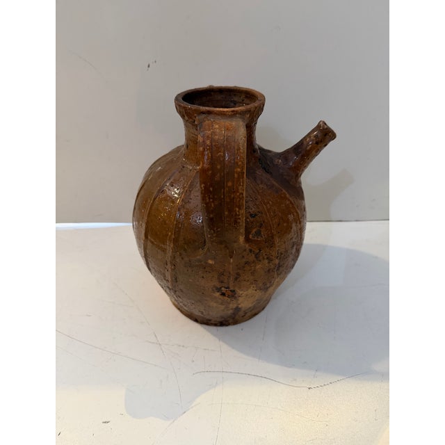 Antique French terracotta walnut oil pot featuring a classic utilitarian form and beautifully aged surface. Traditionally...