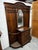 A striking antique Victorian hall tree crafted in richly grained oak with elaborage carved detailing throughout. This...