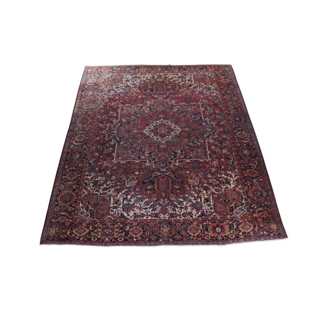 A very large and impressive semi antique Oriental tribal area rug or carpet. Made of wool featuring a geometric and floral...