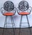 The swinging 1960s! Two 1960s wrought iron stools by Arthur Umanoff, Rye and Gin with orange vinyl seats. Seat height is...