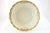 Ornate porcelain bowl with a heavily gold gilt and a spring floral pattern, circa 1920. Maker attributed to...