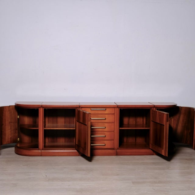 Beautiful living room sideboard, composed of 5 modules, the outer ones are rounded, 4 compartments with doors and a row of...