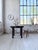 Antique table from 1900, made entirely of solid walnut. Composed of a very thick round top and a spool-style base, its...