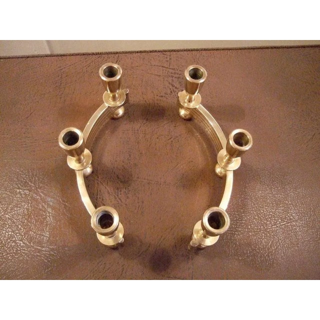 Pair of good quality, heavy, solid brass candleholders, two parts in semi circle shape combine to make an oval.