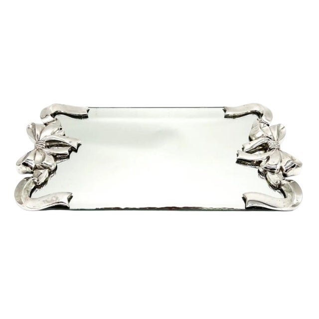Stunning, 1980s Godinger mirrored vanity tray featuring sculptural silver-plated bows and curling ribbon accents at each...