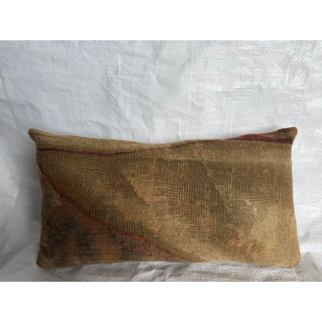 This 16th century Brussels tapestry pillow presents a deeply aged textile surface where the original composition has...