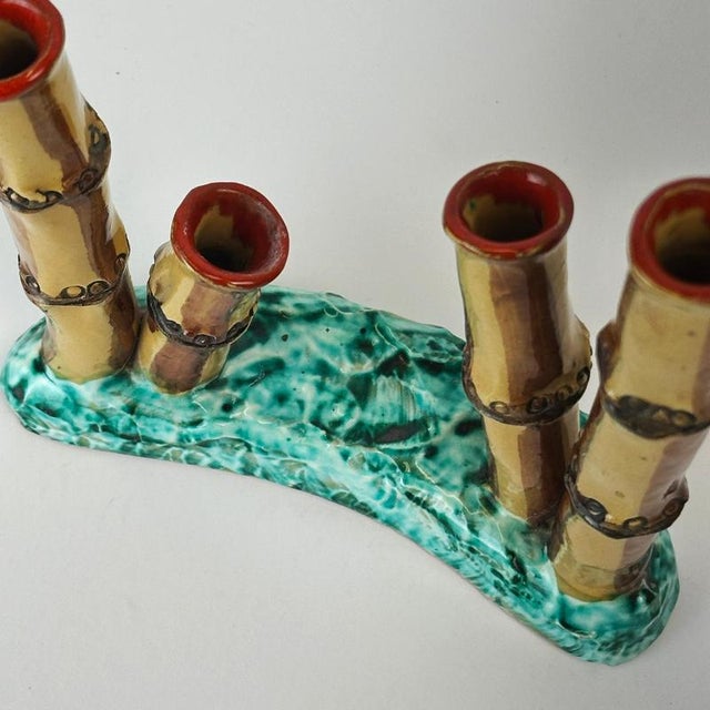 This Italian faux bamboo bud vase dates to the 1960s and presents a whimsical Mid-Century interpretation of natural forms...