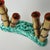 This Italian faux bamboo bud vase dates to the 1960s and presents a whimsical Mid-Century interpretation of natural forms...