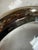 Elegant vintage Gucci clear glass bowl featuring gold-tone metal banding, silver-tone wrapped details, and the iconic...