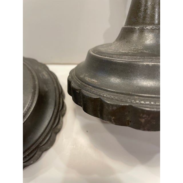 Pair of antique pewter candlestick, baluster form with scalloped petal bases. Unmarked. Combined shipping available,...