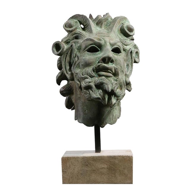 The fired patina (color) of the sculpture is scavo green