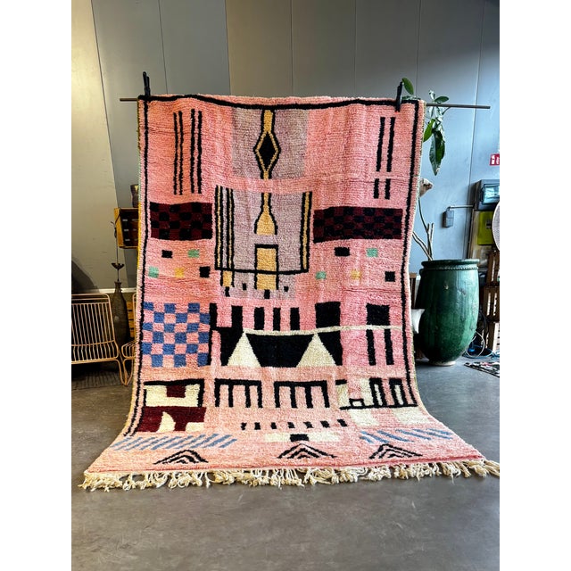 Add a vibrant touch of Moroccan artistry to your home with this custom handmade Berber rug, woven in the Boujad tradition....