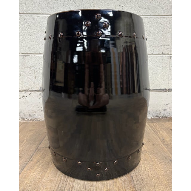 This is a gorgeous black ceramic garden stool. Solid and sturdy, with minor cosmetic imperfections consistent with age....